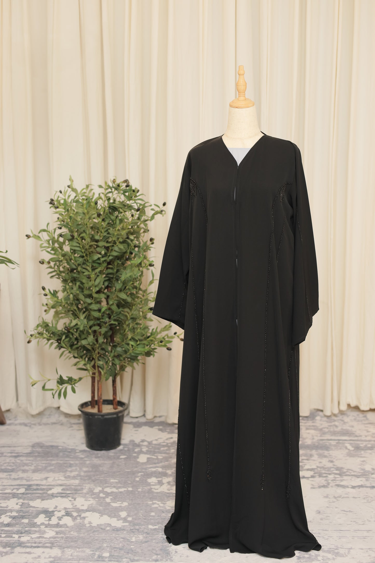 Luxury Black Abaya with Sculpted Beadwork & Minimal Embellishment