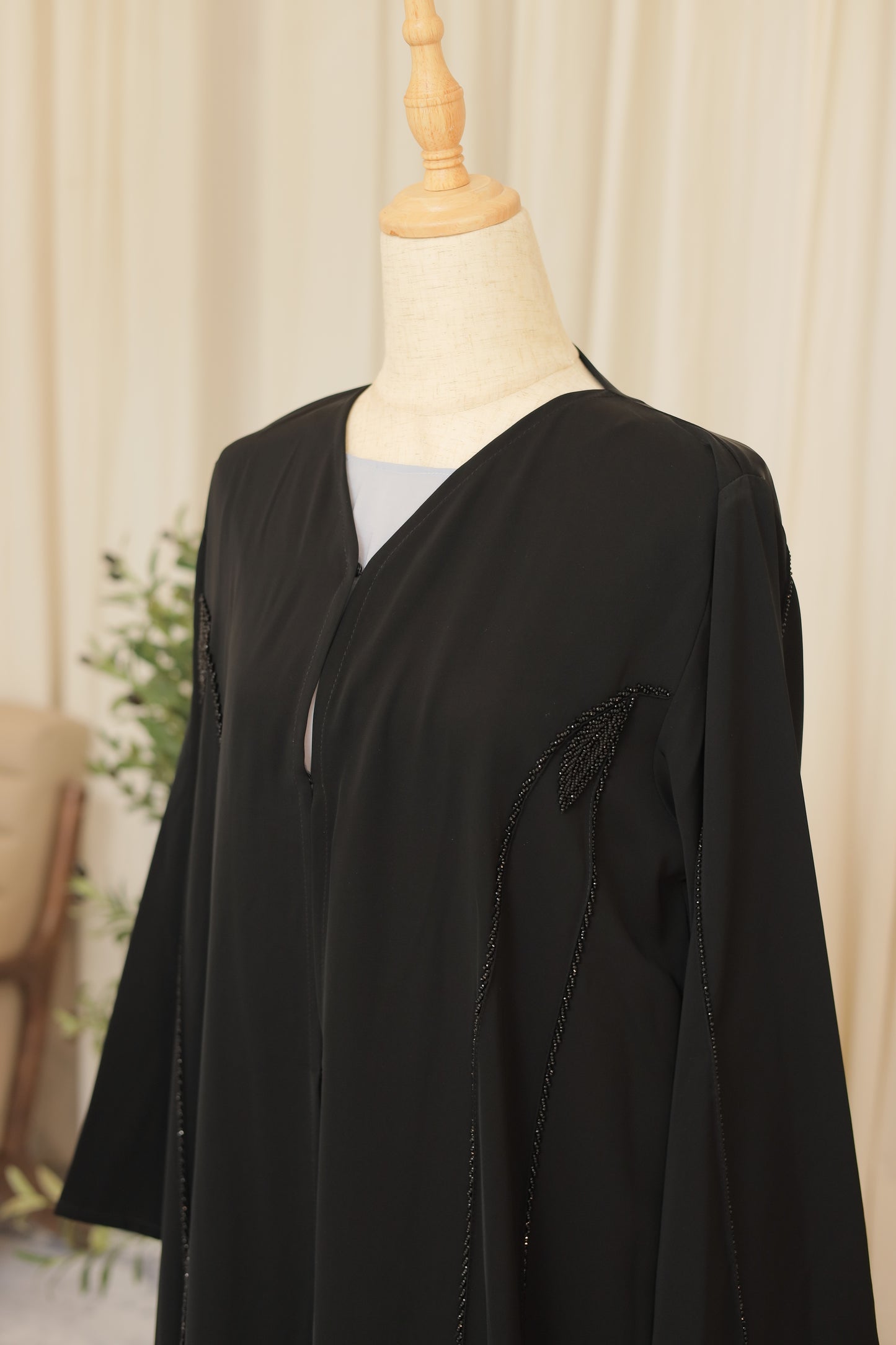 Luxury Black Abaya with Sculpted Beadwork & Minimal Embellishment