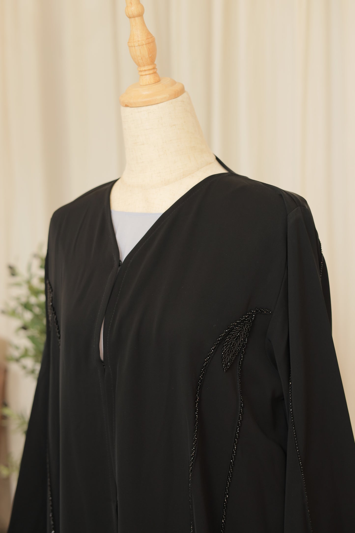 Luxury Black Abaya with Sculpted Beadwork & Minimal Embellishment