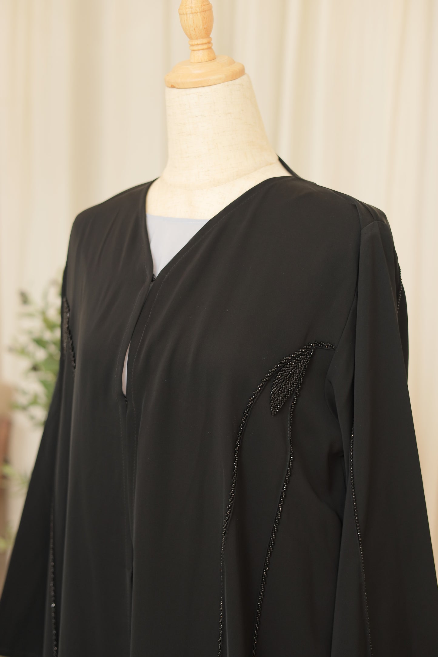 Luxury Black Abaya with Sculpted Beadwork & Minimal Embellishment